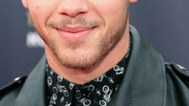Illustration for article titled Can You Find Nick Jonas's Mustache?